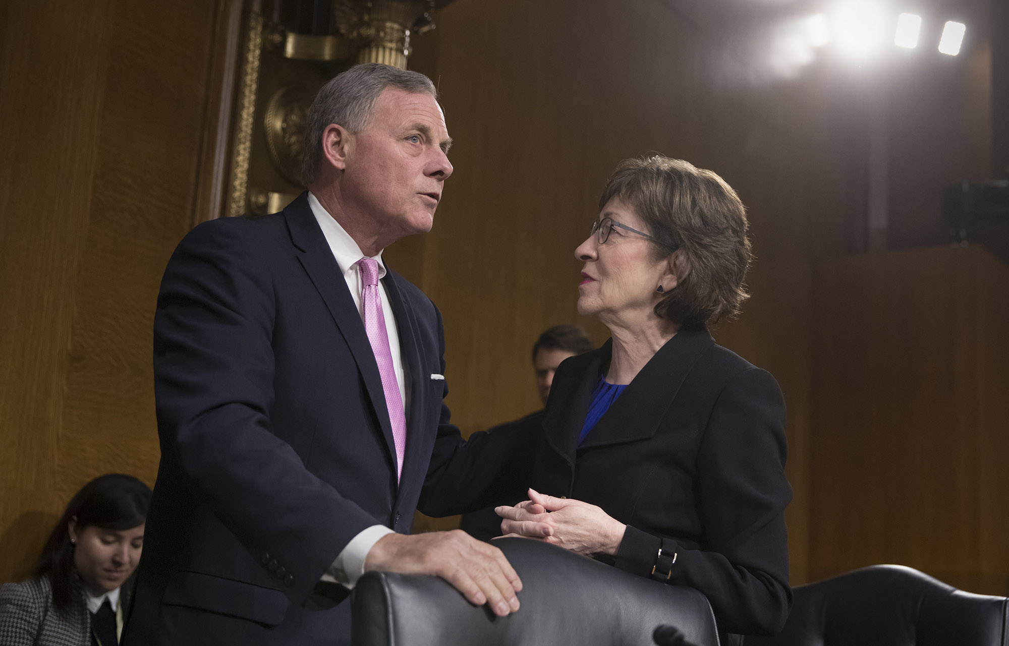 Sen. Richard Burr, R-N.C., right, chairman of the Senate Select Committee on Intelligence, confers with Sen. Susan Collins, R-Maine, at the start of a hearing to examine problems and practices of issuing security clearances to government employees, at the Capitol in Washington, Wednesday, March 7, 2018. (AP Photo/J. Scott Applewhite)