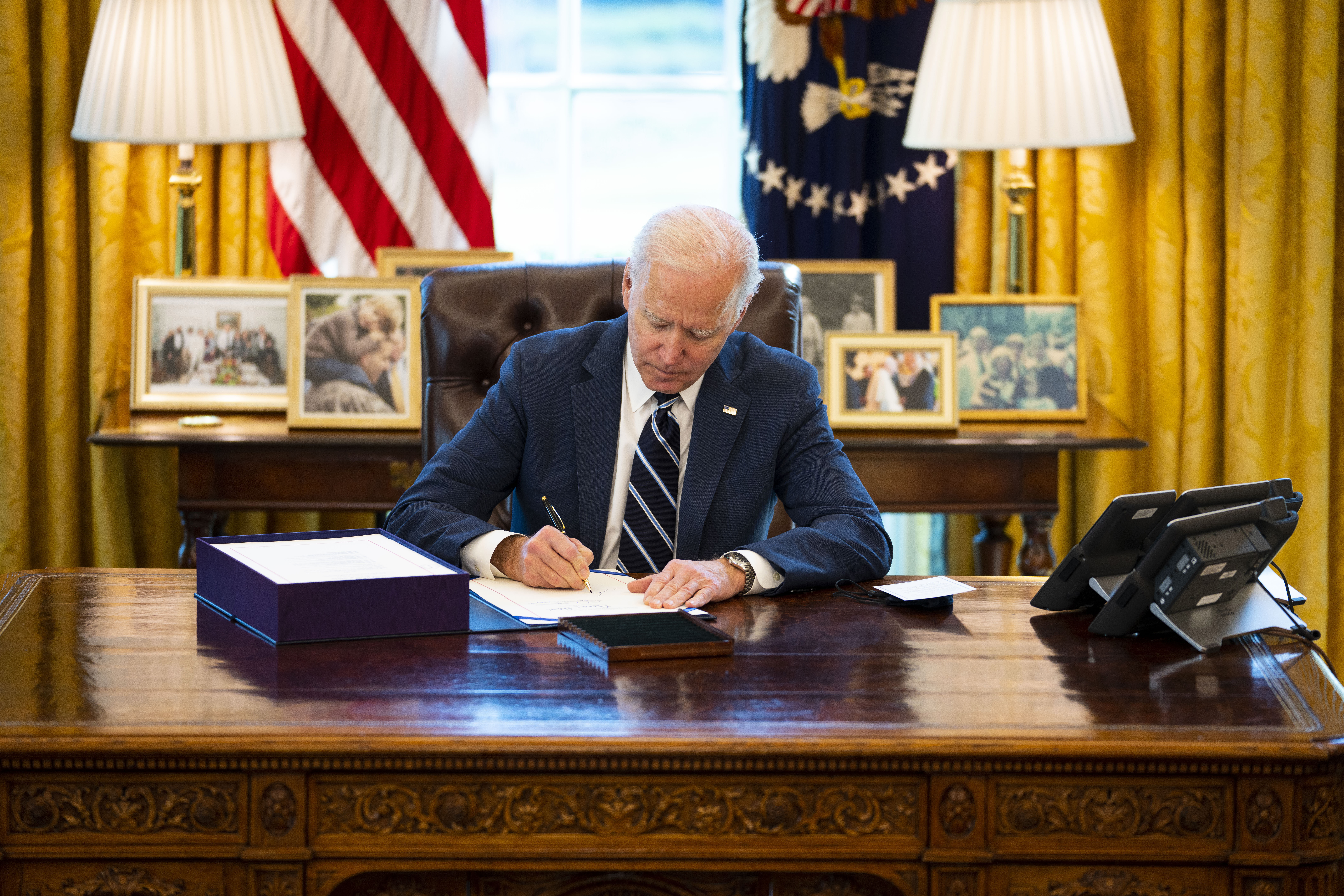 WASHINGTON, DC - MARCH 11: U.S. President Joe Biden participates in a bill signing in the Oval Office of the White House on March 11, 2021 in Washington, DC. President Biden has signed the $1.9 trillion COVID relief bill into law at the event. (Photo by Doug Mills-Pool/Getty Images)