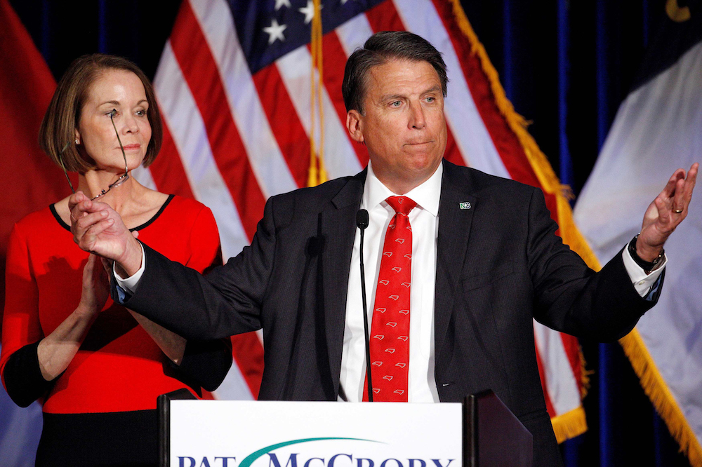 North Carolina Governor Pat McCrory tells supporters that the results of his contest against Democratic challenger Roy Cooper will be contested, while his wife Ann looks on, in Raleigh, North Carolina, U.S. November 9, 2016.  REUTERS/Jonathan Drake/File Photo
