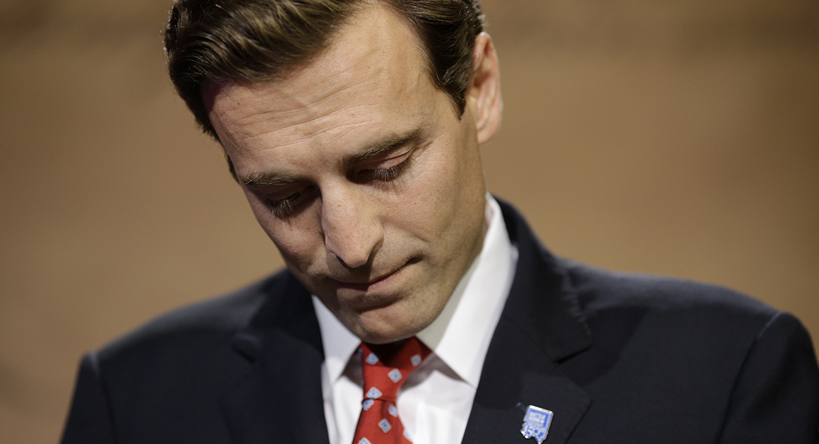 FILE - In this Oct. 14, 2014 file photo, Adam Laxalt prepares before a debate with Nevada Secretary of State Ross Miller in Las Vegas. Laxalt has been going against strong headwinds from the time he first announced his underdog campaign against two-term Democratic Secretary of State candidate Ross Miller last January, all the way up to the drive from southern to northern Nevada to move into his new post. “He was the one guy who never had a doubt that he could win, said Robert Uithoven, Laxalt's campaign consultant. (AP Photo/John Locher, File)